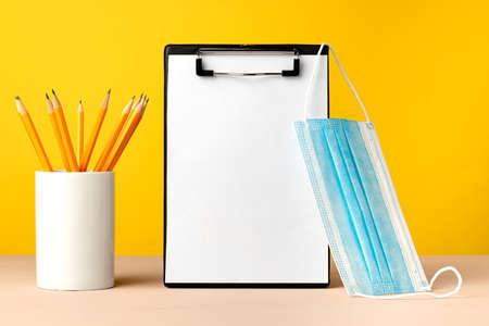 Clipboard with copy space and medical face maskの写真素材