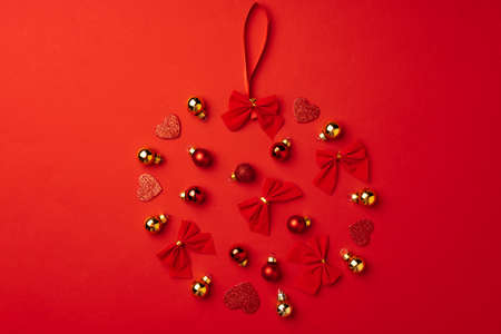 Red Christmas baubles on red background top viewの写真素材