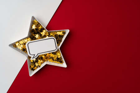 Star shaped plate with golden confetti top view