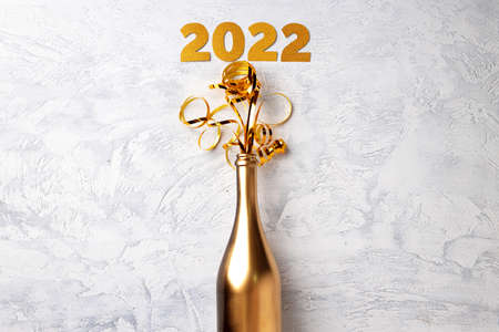 Champagne bottle with streamers flat lay top viewの写真素材