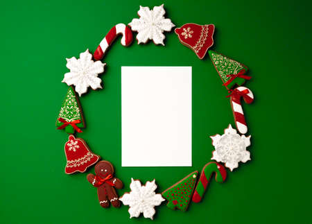 Blank paper and gingerbread Christmas cookie top viewの写真素材