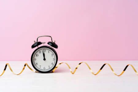 Christmas and New Year countdown concept with alarm clock