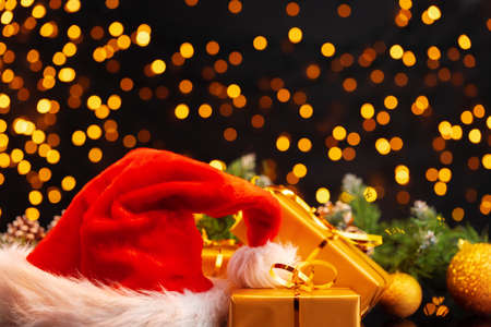Wrapped Christmas gifts on golden lights bokeh backgroundの写真素材