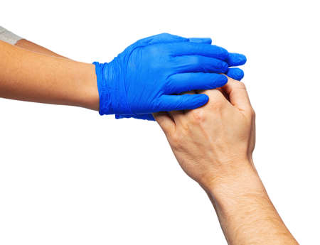 Male and female hands in medical gloves stretch to each other. Help concept.の写真素材