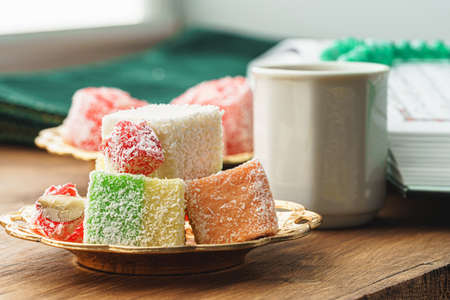 Close up of a little plate with turkish sweets and cup of espressoの写真素材