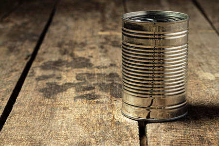 Tin cans with food on the table.の写真素材