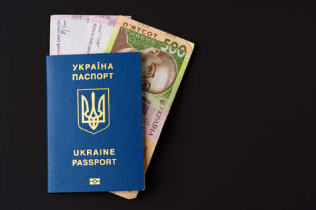 Ukrainian hryvnia banknotes in ukrainian passport close upの写真素材