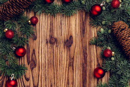 Christmas background with decorations on brown wooden boardの写真素材