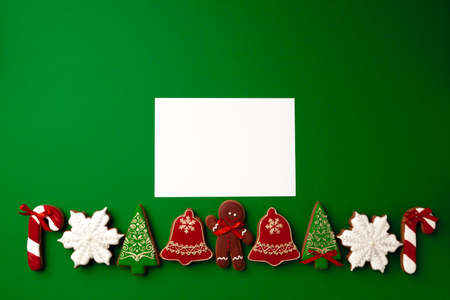 Blank paper and gingerbread Christmas cookie top viewの写真素材