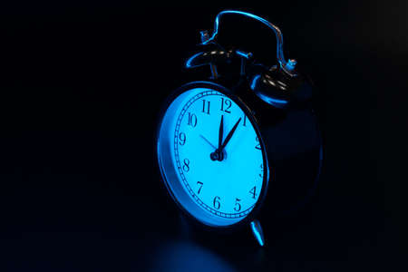 Alarm clock close up on black backgroundの写真素材