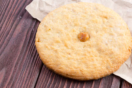 Oat cookies served on wooden table close up