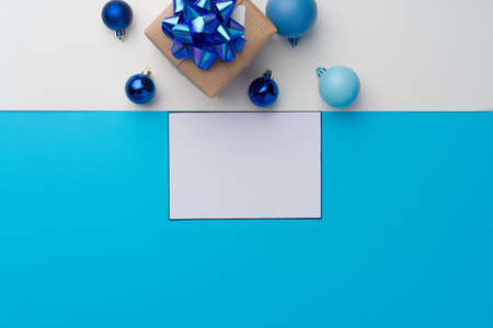 Top view of gift box with ribbon on blue backgroundの写真素材