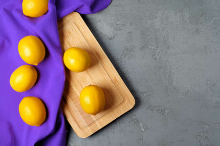 Lemons on concrete background, view from above