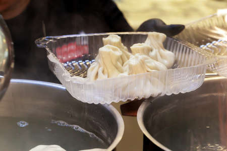Process of preparing khinkali in a cafe close up