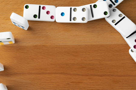 White domino dice on a wooden tableの写真素材