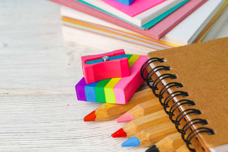 Color pencils on wooden table close up
