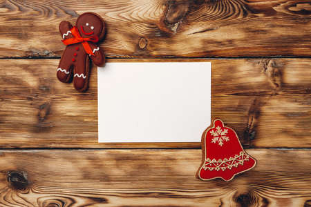 Christmas greeting card or letter to Santa with gingerbread biscuit