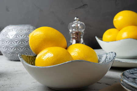 New ceramic dishware with several lemons for decorationの写真素材