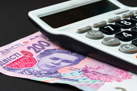 Calculator with ukrainian hryvnia banknotes close upの写真素材