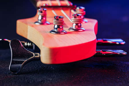 Guitar headstock with tuners on dark backgroundの写真素材