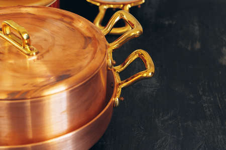 Clean copper cookware in kitchen close upの写真素材