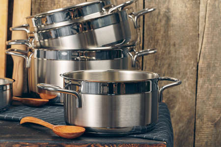 Set of dishware against old wooden backgroundの写真素材