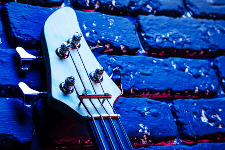 Guitar headstock with tuners on dark backgroundの写真素材