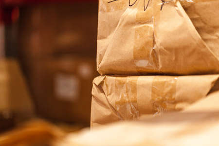Modern warehouse shelves with pile of cardboard boxesの写真素材