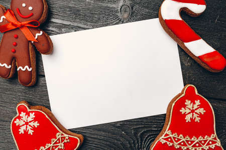 Christmas greeting card or letter to Santa with gingerbread biscuit