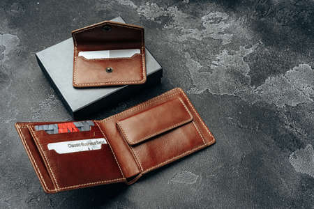 New brown leather wallet on dark background