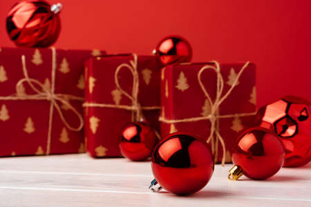 Christmas gift boxes against red background front view