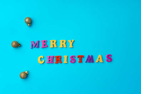 Words Merry Christmas on blue background top viewの写真素材