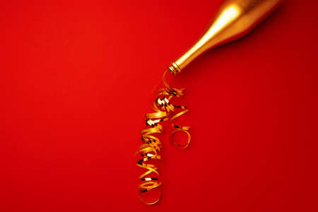 Champagne bottle with streamers flat lay top viewの写真素材