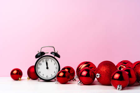 Christmas and New Year countdown concept with alarm clockの写真素材
