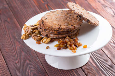 Oat cookies served on wooden table close upの写真素材