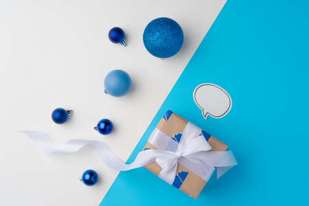 Top view of gift box with ribbon on blue backgroundの写真素材