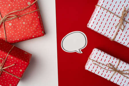 Beautiful red and white composition with Christmas giftsの写真素材