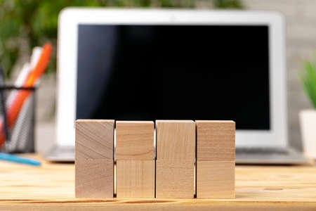 Blank wooden cubes with copy space for your design on office working tableの写真素材