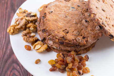 Oat cookies served on wooden table close up