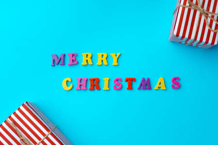 Words Merry Christmas on blue background top viewの写真素材