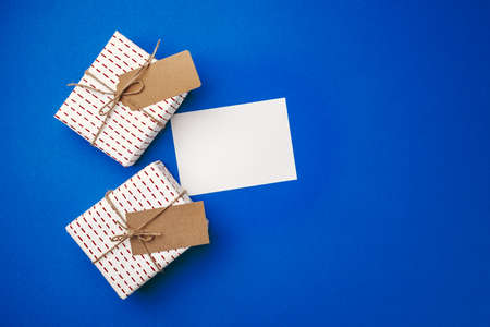 Christmas gift wrapped in paper with bow top viewの写真素材
