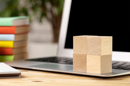 Blank wooden cubes with copy space for your design on office working tableの写真素材