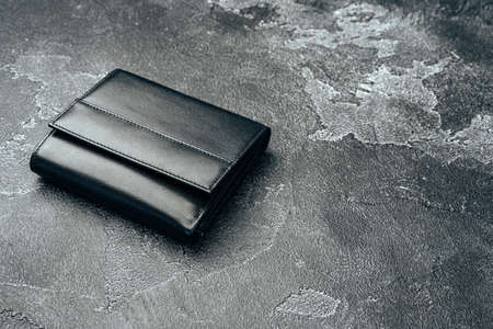 New black leather wallet on dark backgroundの写真素材