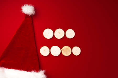 Santa Claus hat on red background top view