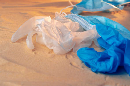 Protective facial mask on the natural outdoors beach backgroundの写真素材