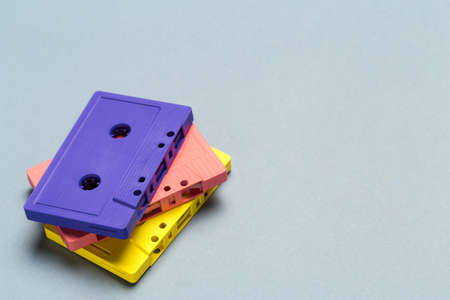 Bright retro cassette tapes on a light grey backgroundの写真素材