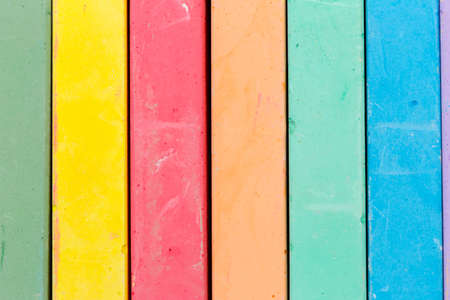 Set of colored chalks over a black backgroundの写真素材