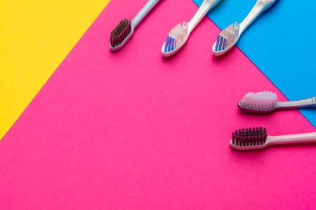 Flat lay composition with manual toothbrushes on color background, close upの写真素材