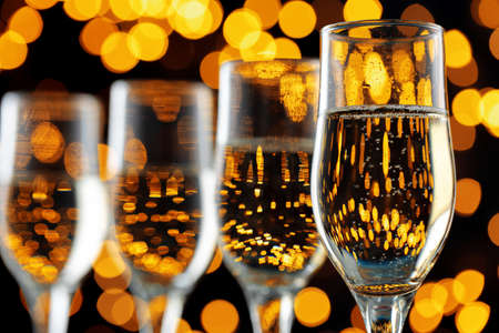 Close up photo of Champagne glasses against bokeh backgroundの写真素材