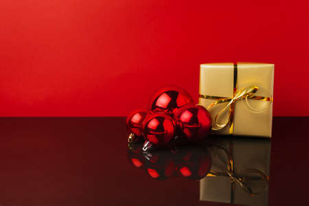 Background with a bunch of red shiny Christmas baubles